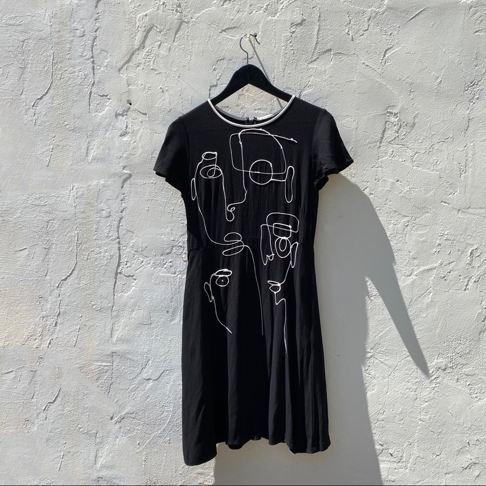 Fitted flowy black mid length dress